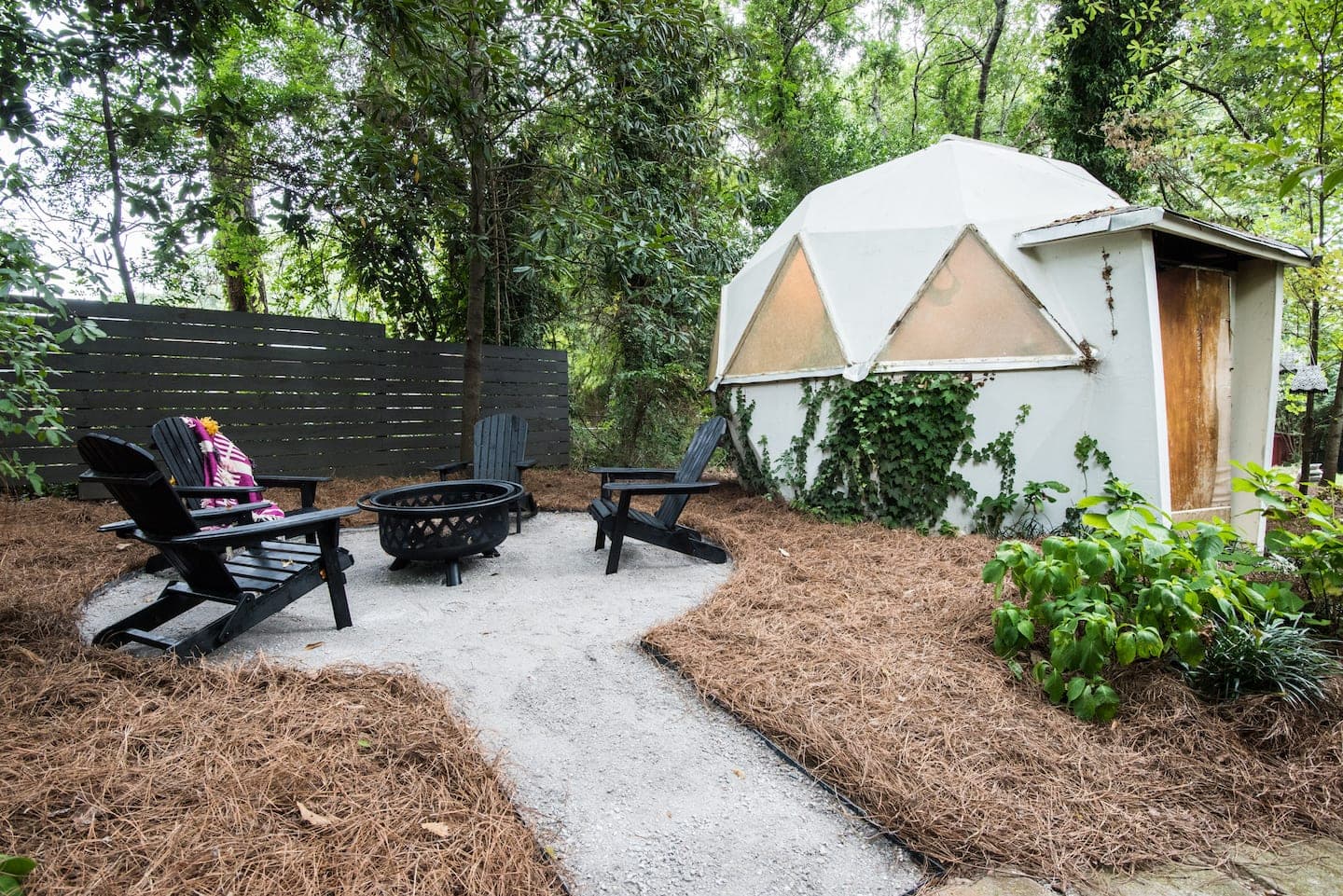 Adirondack chairs, the fire pit, and the geo dome in full.
